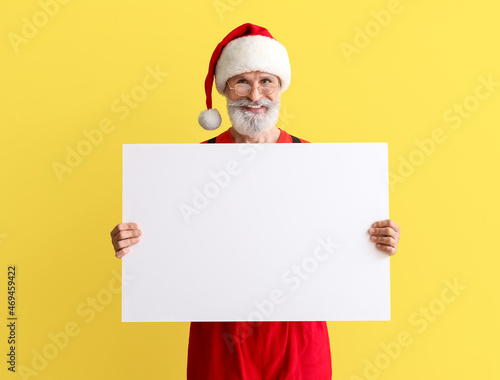 Santa Claus with blank post...