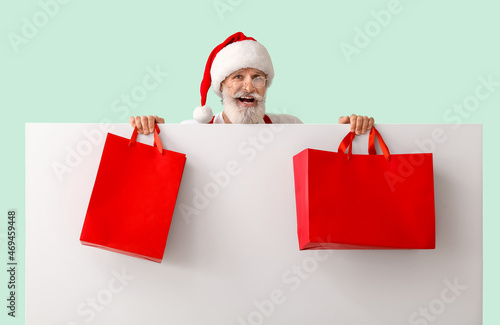 Santa Claus with blank post...