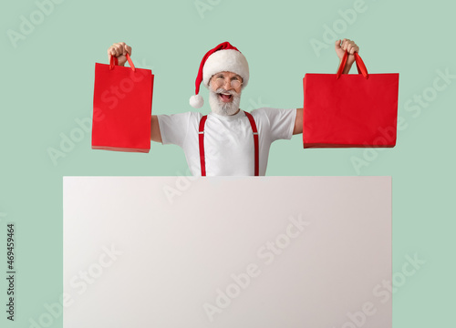 Santa Claus with blank post...