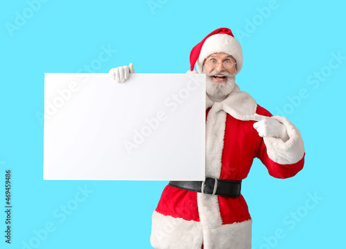 Santa Claus with blank post...
