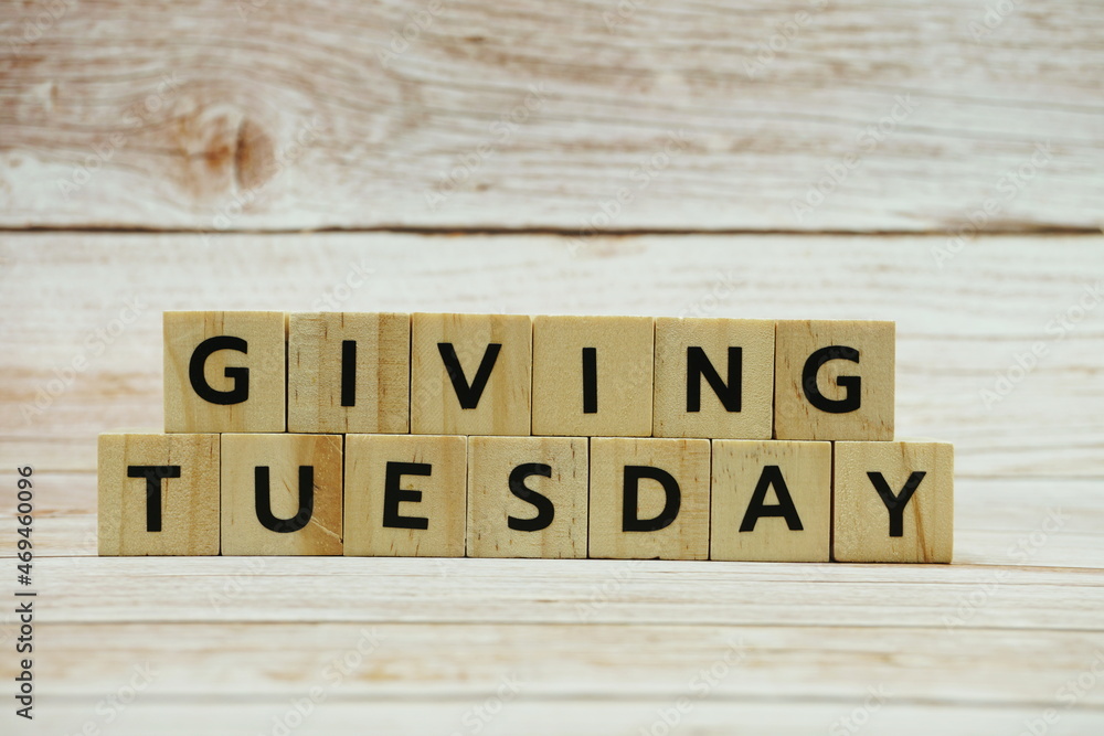 Giving Tuesday alphabet letter on wooden background Giving Tuesday alphabet letter on wooden background