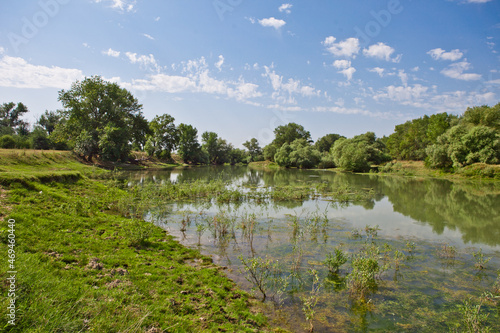Fototapeta Naklejka Na Ścianę i Meble -  river on the plain against the blue sky