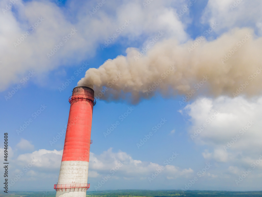 plant pipe with smoke against blue sky plant pipe with smoke against blue sky