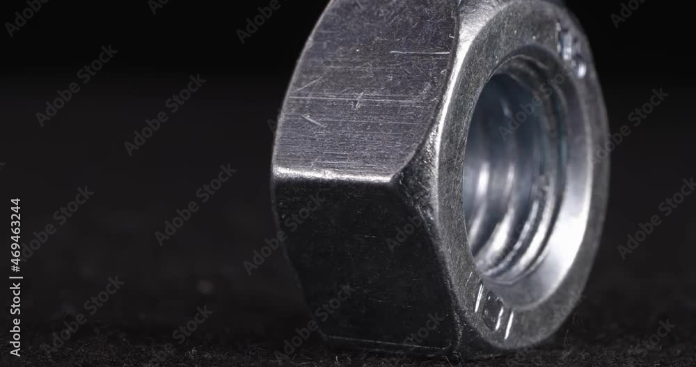 Screw close-up on a dark background. Fastener side view . Screw close-up on a dark background. Fastener side view .