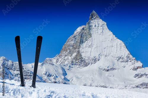 Skiing in the Swiss Alps. Ski, winter season, mountains and ski equipments
