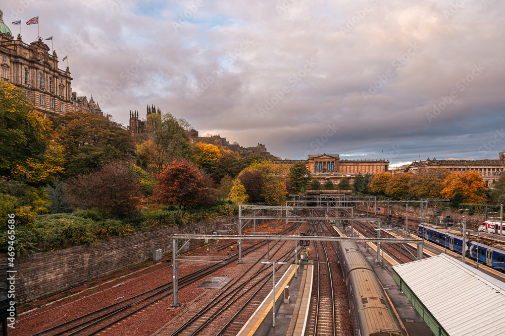 Fototapeta premium Waverley Edinburgh Train historical rail station during an autumn cloudy morning. Landmarks of Scotland, United Kingdom. Transportation industry, travel by trains.