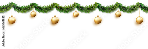 Christmas garland of fir branches and golden balls strangled by snow isolated on white background. Seamless banner, can be extended to desired size.