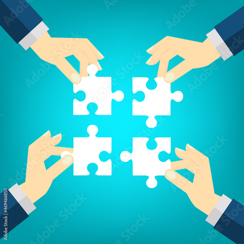 Teamwork. Business concept. Team connecting puzzle elements. Symbol of teamwork, cooperation, partnership.