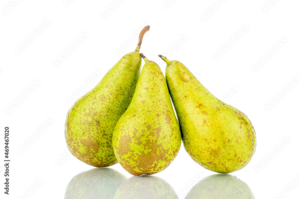 Three ripe sweet pears, close-up, isolated on white. Three ripe sweet pears, close-up, isolated on white.