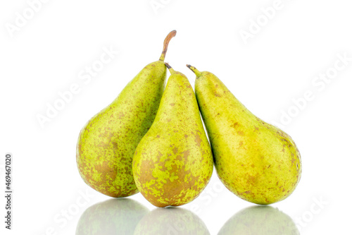 Three ripe sweet pears, close-up, isolated on white.