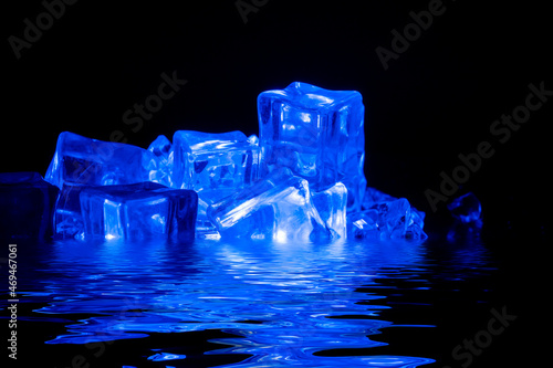 Slika na platnu Ice cubes filling with smoke on a dark background