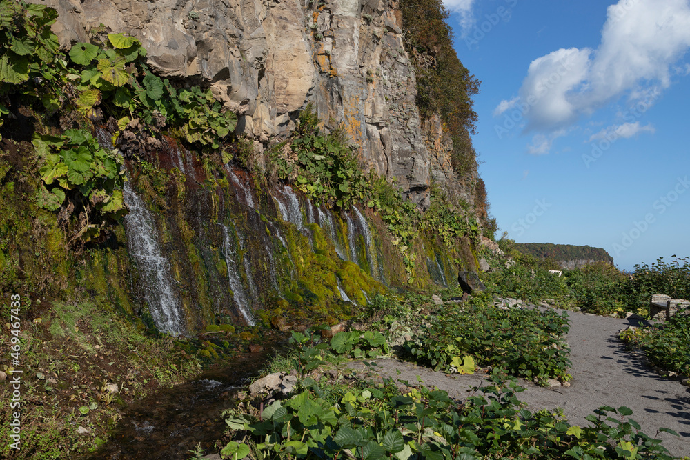 Rock with waterfalls, Iturup Island, South Kuriles