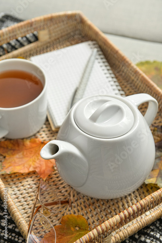 Tray with tea pot on sofa