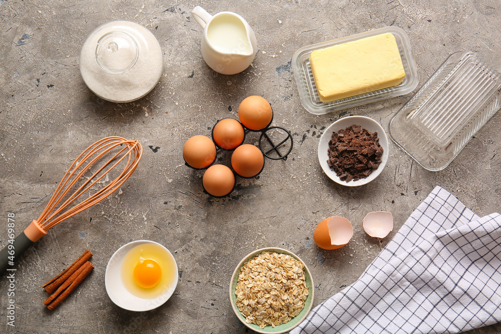 Ingredients for preparing homemade cookies on grey background Ingredients for preparing homemade cookies on grey background