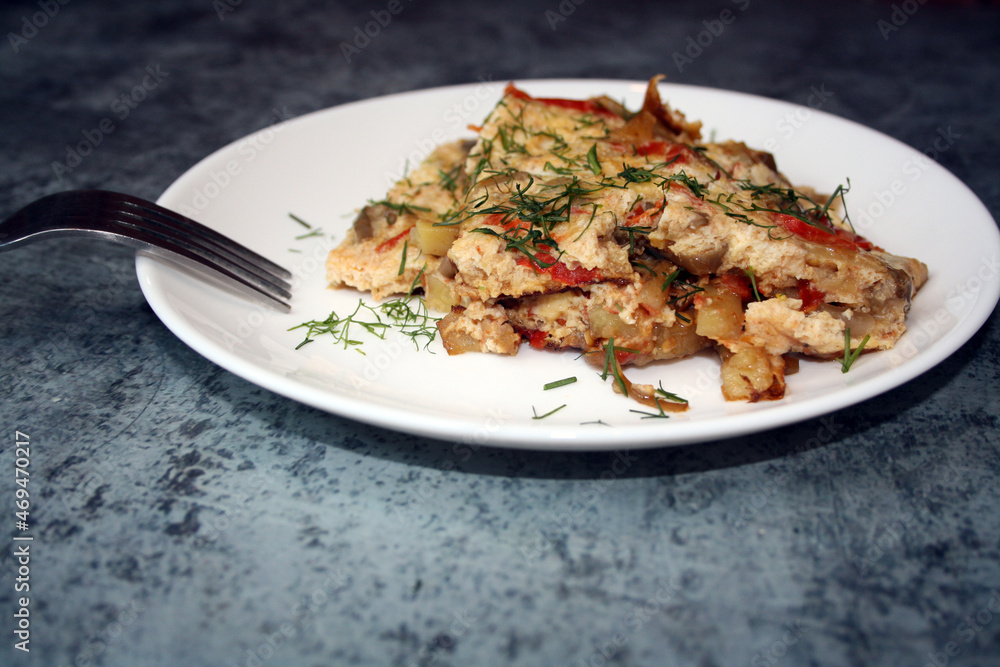 Frittata made from potatoes, peppers, tomatoes and eggplants. A hearty breakfast. Frittata made from potatoes, peppers, tomatoes and eggplants. A hearty breakfast.