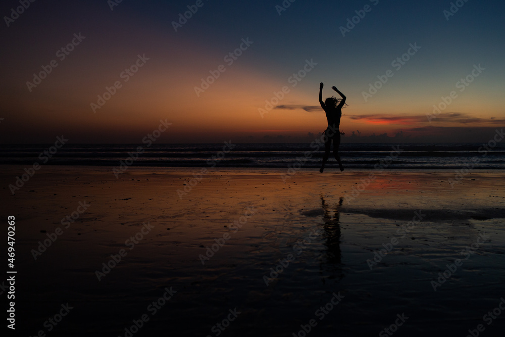 beautiful girl dancing at sunset.