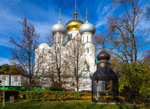 Novodevichy convent (Bogoroditse-Smolensky monastery) on a sunny autumn day. Cathedral of Our Lady of Smolensk (16th century). Moscow, Russia. UNESCO world heritage site photo