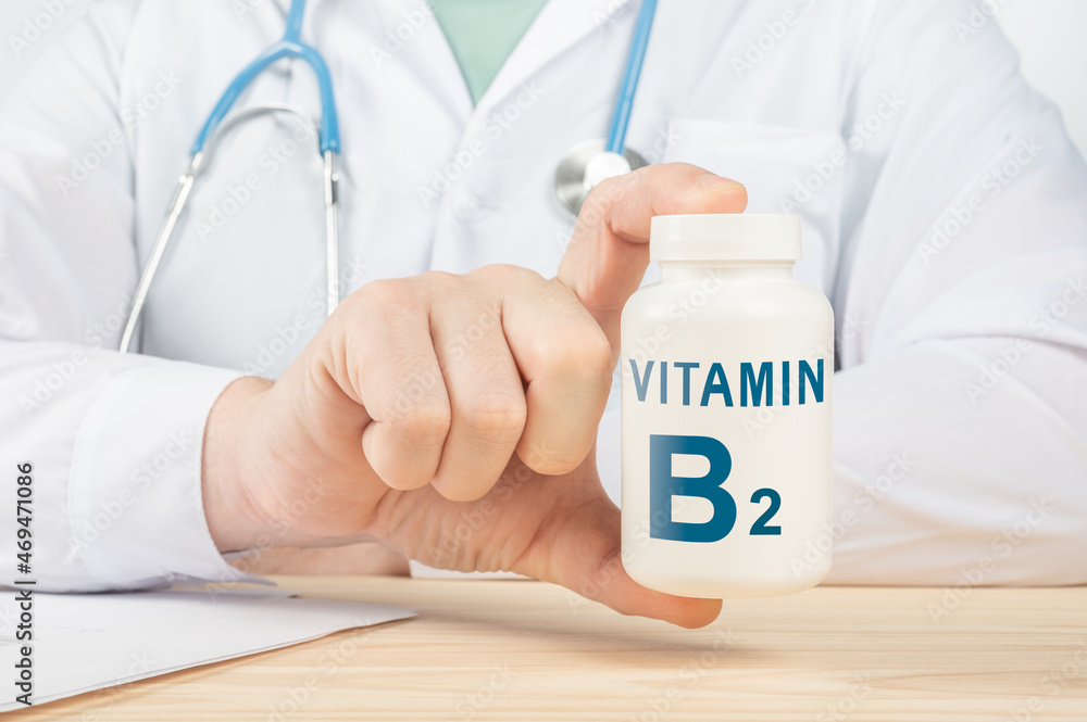 Essential vitamin B2 and minerals for humans. doctor taking