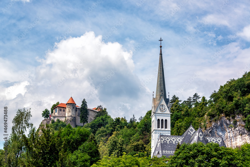 View of a church and Bled Castle in Slovenia