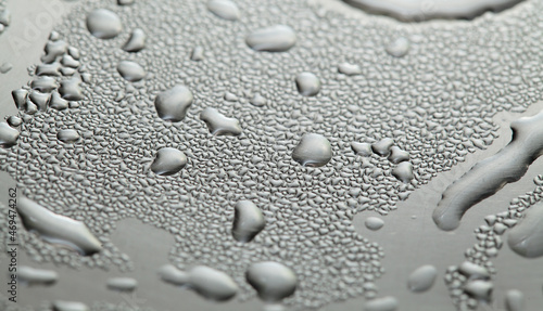 Macro background with water droplets condensation pattern on metal surface  