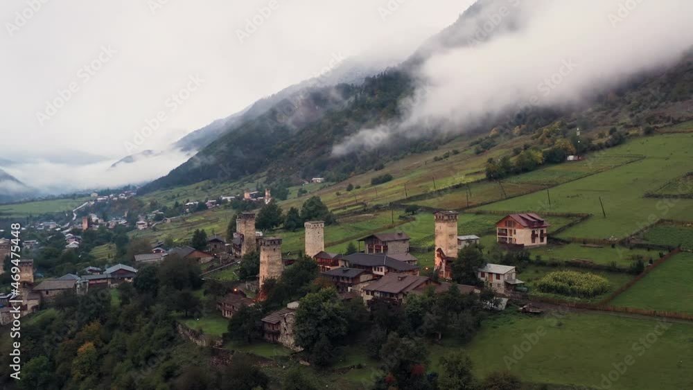 Aerial view of the mountain village of Mestia.
Mountains and trees are hidden in the clouds. Amazing landscape. 4K drone video.Caucasus mountains. Mountain Svaneti. Svan defensive towers.
Aerial view of the mountain village of Mestia.
Mountains and trees are hidden in the clouds. Amazing landscape. 4K drone video.Caucasus mountains. Mountain Svaneti. Svan defensive towers.