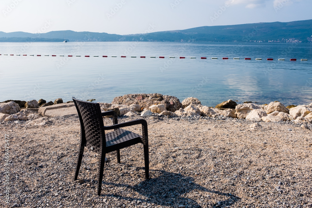 An empty  beach chair by the Adriatic seaside in Montenegro.
