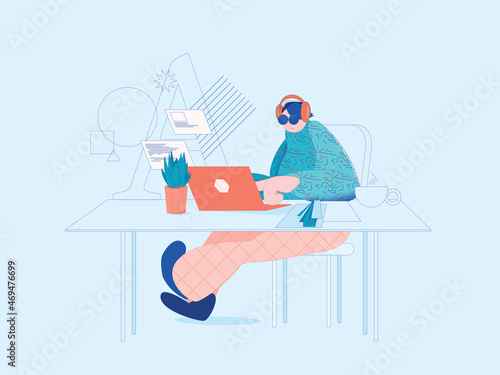 Freelancer graphic designer works in a nicely decorated modern office on a laptop