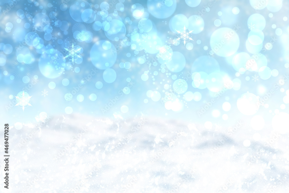 Abstract blurred festive winter christmas or Happy New Year background with shiny blue and white bokeh lighted snow landscape with sky. Space.