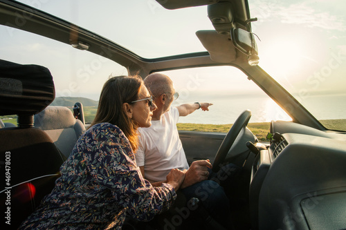 Aged couple enjoying their retirement holidays on the coast