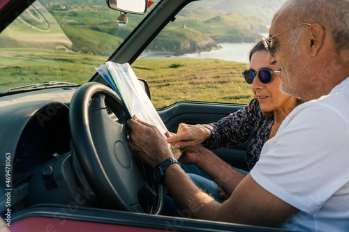 Aged couple enjoying their retirement holidays on the coast