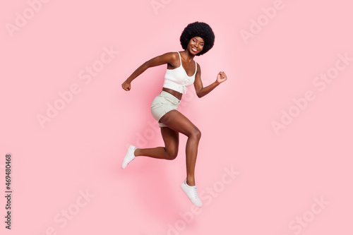 Full length body size photo girl smiling jumping up running on sale isolated pastel pink color background