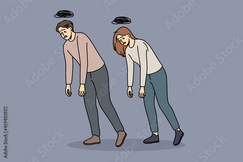 Tiredness and common exhaustion concept. Young man and woman walking with hands down feeling tired zombie vector illustration 