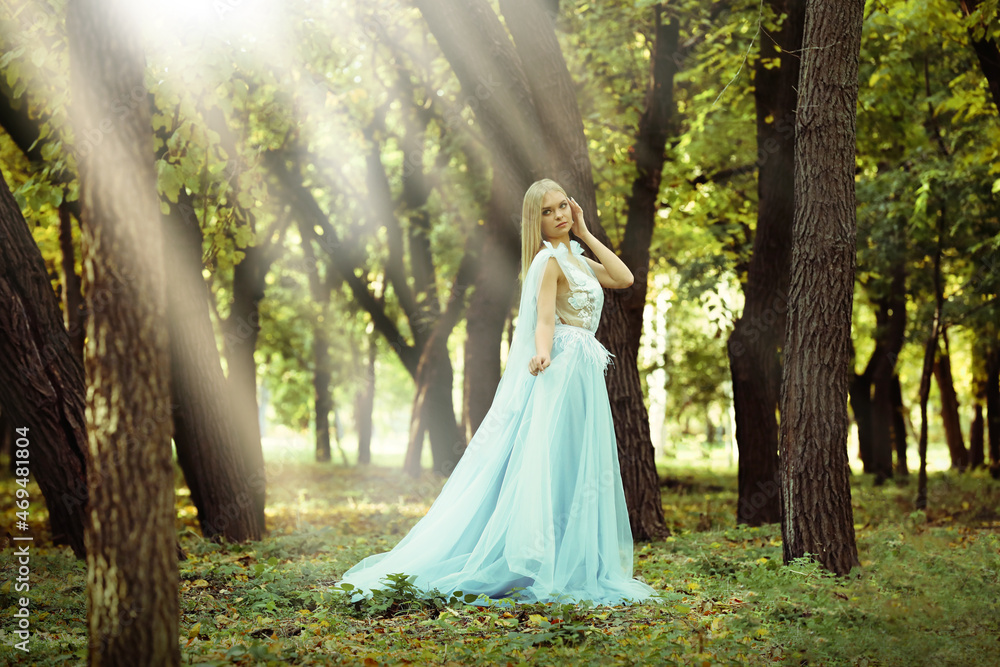 Beautiful girl wearing fairy dress in autumn forest Beautiful girl wearing fairy dress in autumn forest