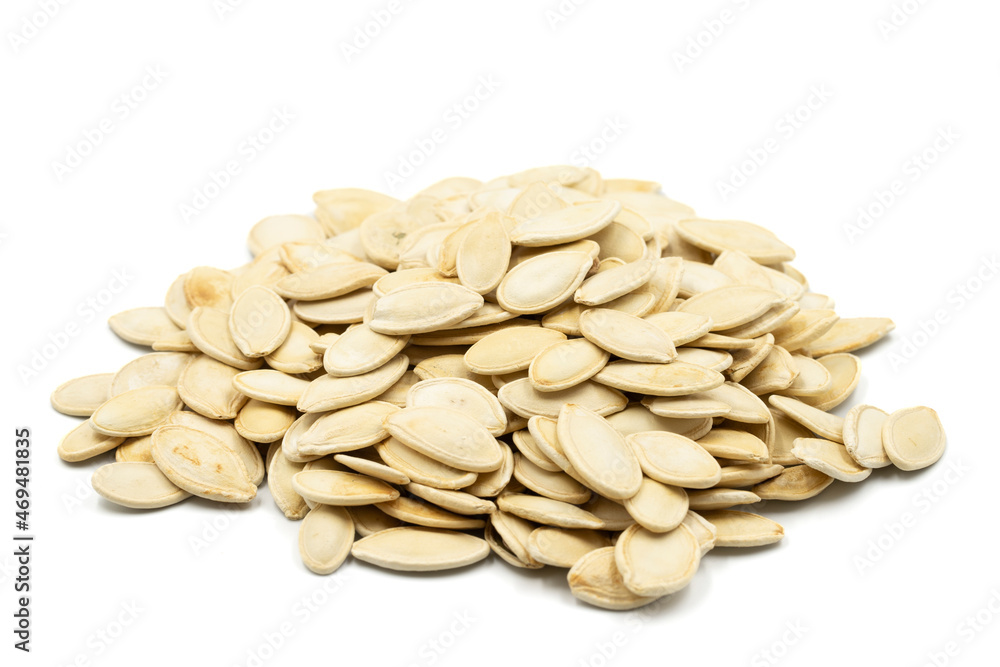 Pumpkin seeds isolated on white background. Snack fresh nuts. close-up nuts Pumpkin seeds isolated on white background. Snack fresh nuts. close-up nuts
