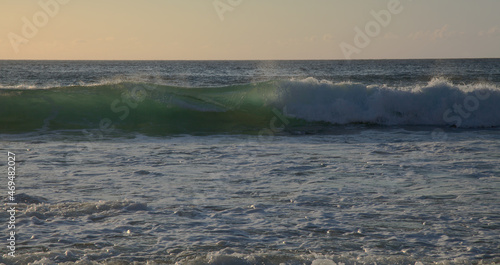 Fuerteventura, west coast, powerful ocean waves at sunset time, partially translucent