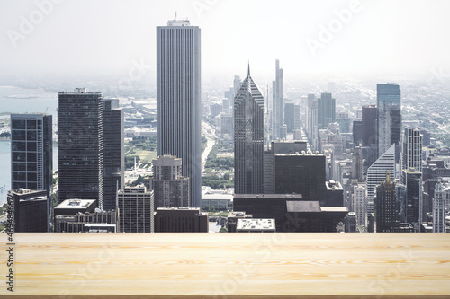 Blank table top made of wooden planks with beautiful Chicago cityscape at daytime on background, mockup © Pixels Hunter