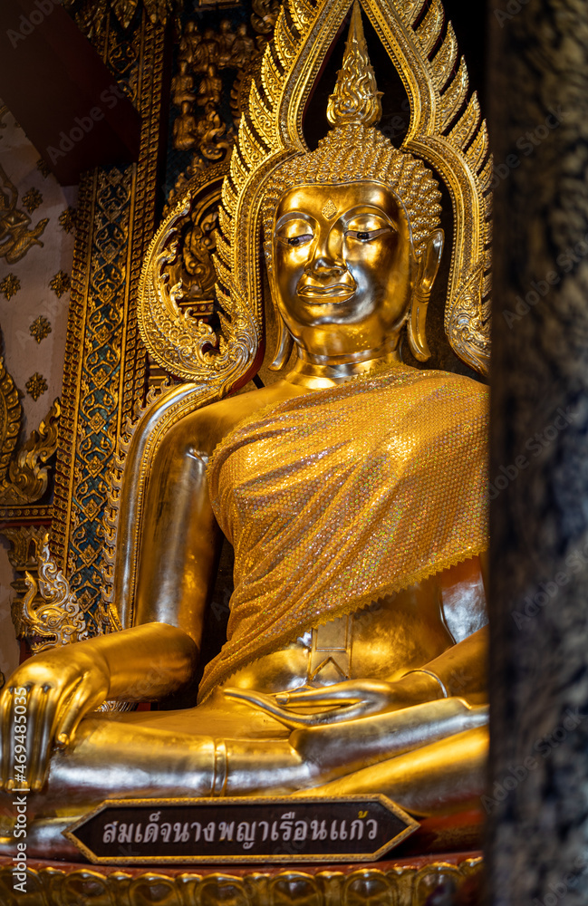 Fototapeta premium Phitsanulok, THAILAND - November 12, 2021: Somdet Nang Phaya Ruean Kaew is the name of the Buddha Statue in a chapel of Nang Phaya Temple, Phitsanulok province.