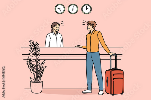 Checking in and reception concept. Young man client guest standing and communicating with young woman receptionist during check in in hotel vector illustration 