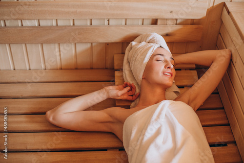 Young woman having rest in sauna alone