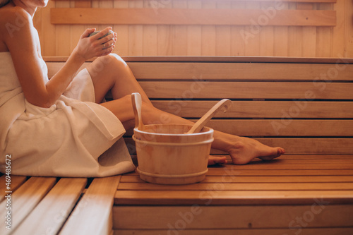 Young woman having rest in sauna alone