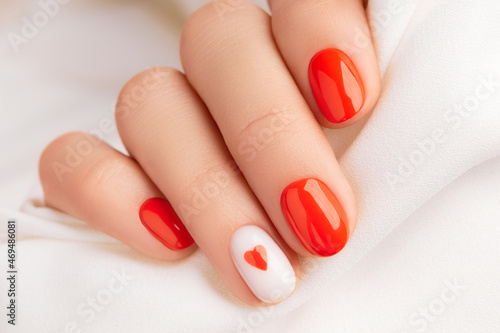 Close up manicured womans hand. Fashionable valentines day nail design