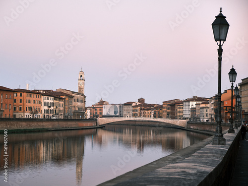 the church of Pisa, tuscany, italy, beside the river and the reflection of the colorful houses