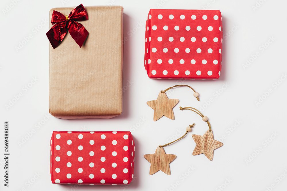 Obraz premium Christmas composition. Gifts, christmas wooden stars. Layout for the holiday. Top view, flat lay