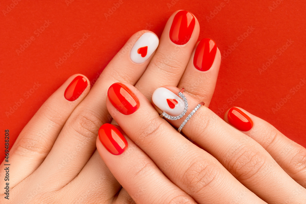 Manicure gel polish of red color with sparkles on female hands with rings  6696536 Stock Photo at Vecteezy