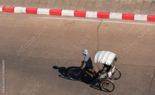 High angle view of a vintage tricycle spinning on a concrete road