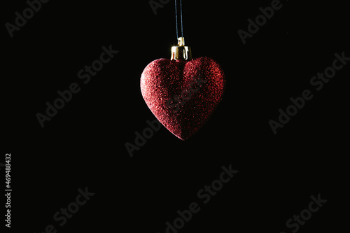 Christmas bauble over dark background. Low key photo