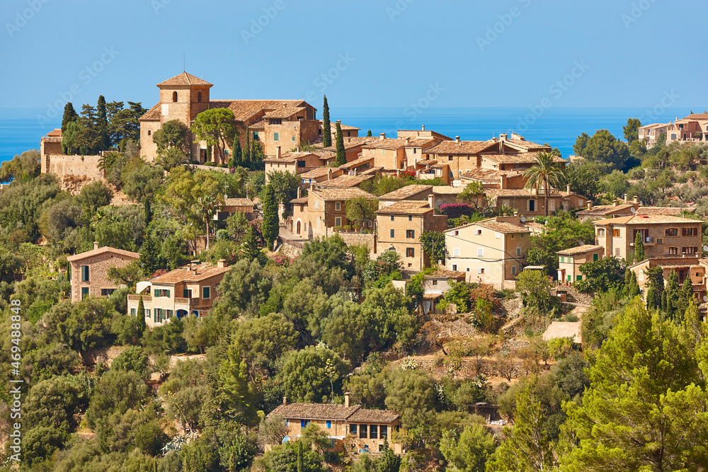 Traditional stone houses and tramuntana mountains in Deia. Balearic islands