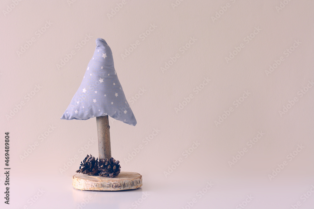 Handmade Christmas tree on a beige background. Copy space for Christmas greetings. Handmade Christmas tree on a beige background. Copy space for Christmas greetings.