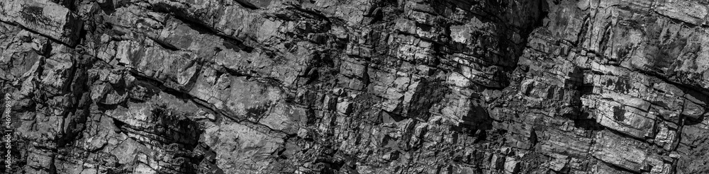 Grungy cragged bumpy pitted cavity stone facade, split layer gap.Ruined cracked shattered worn rough hiking canyon.Old ragged grunge steep marble cliff. Grand vintage crannied damaged impressive gorge Grungy cragged bumpy pitted cavity stone facade, split layer gap.Ruined cracked shattered worn rough hiking canyon.Old ragged grunge steep marble cliff. Grand vintage crannied damaged impressive gorge