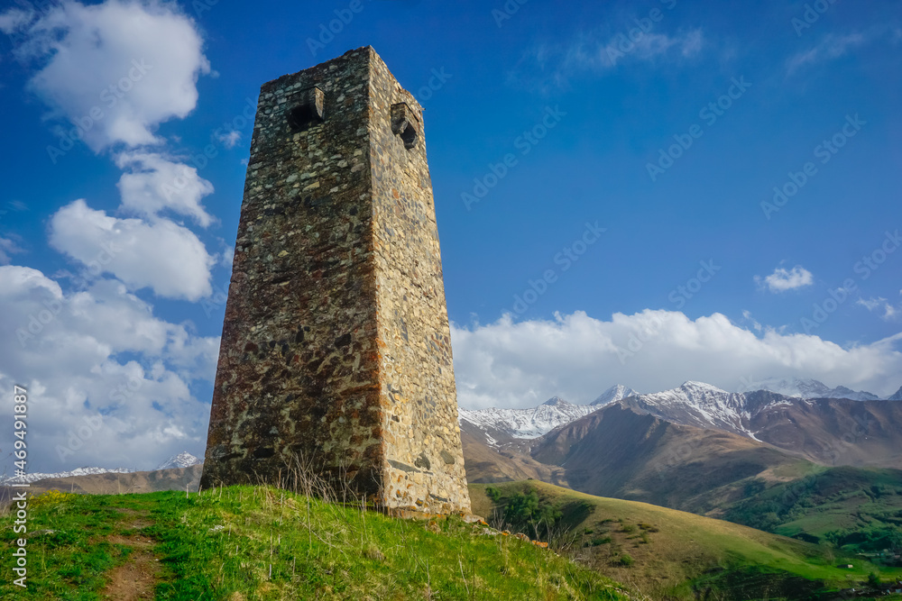 Ancient stone tower in the mountains